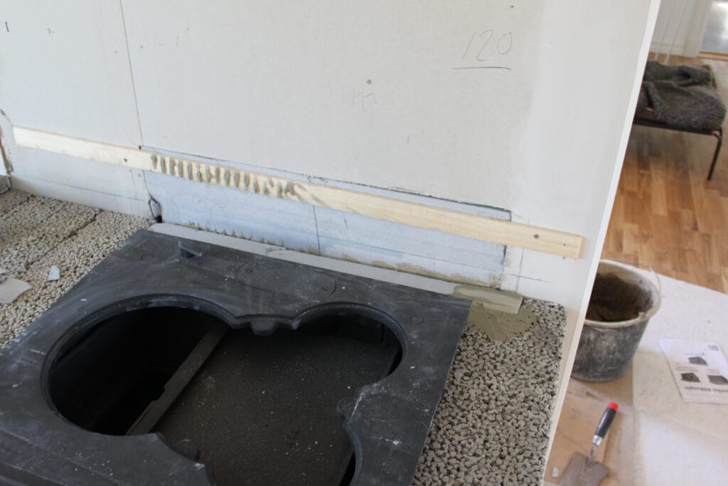 Installation av vedspis i ett nybyggt hus